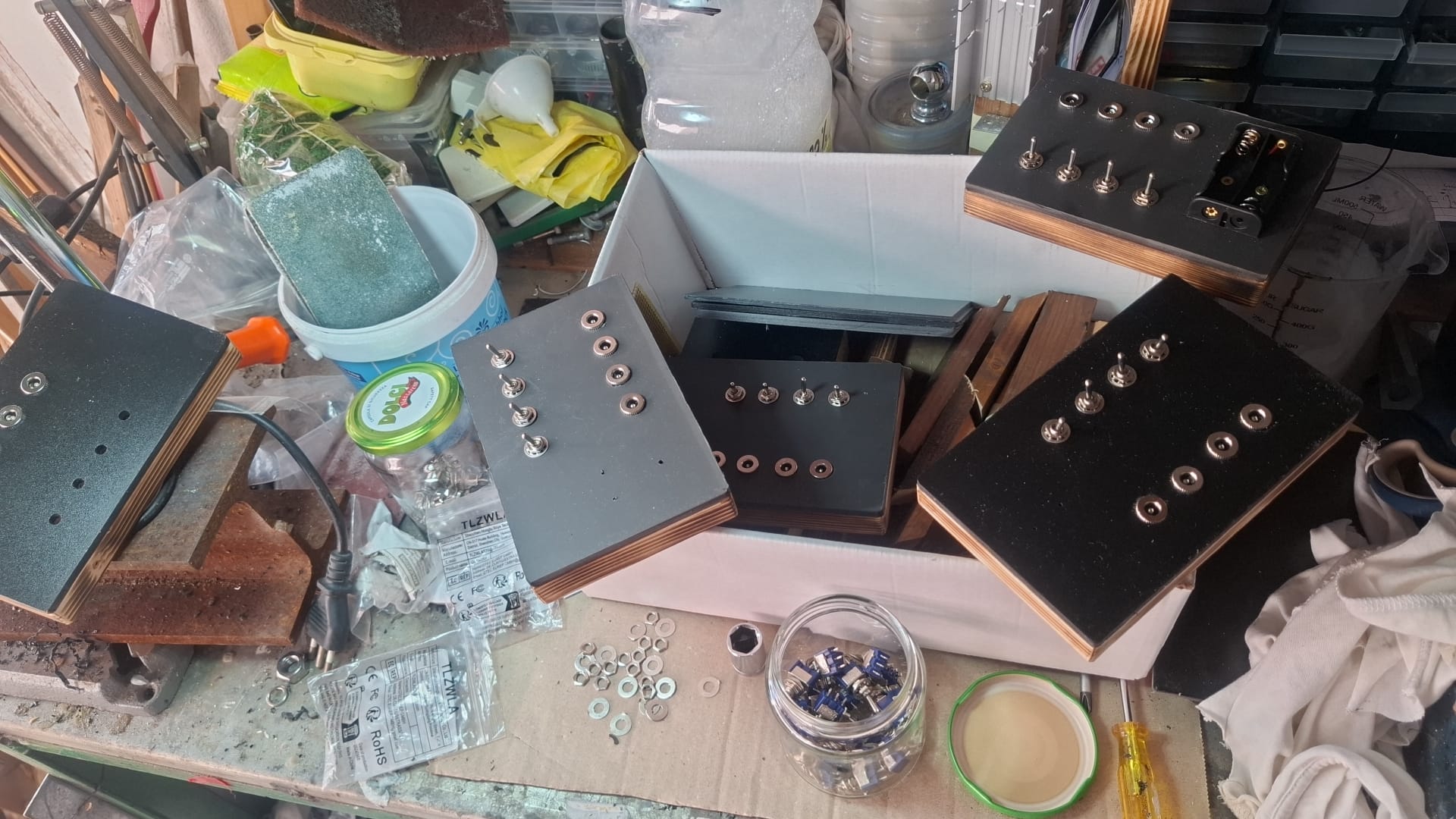 Workshop — multiple Turing Boxes in production, father building the wooden shells by hand